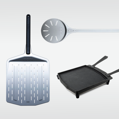 Ooni perforated peel, turning peel and cast iron skillet displayed on a light grey background.